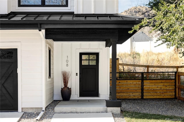108 Arapahoe St, Golden, CO 80403 - doorway to property featuring a standing seam roof, board and batten siding, and metal roof