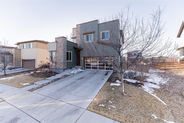 view of front of home featuring an attached garage and concrete driveway