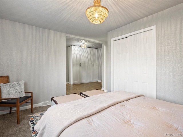 carpeted bedroom with a closet