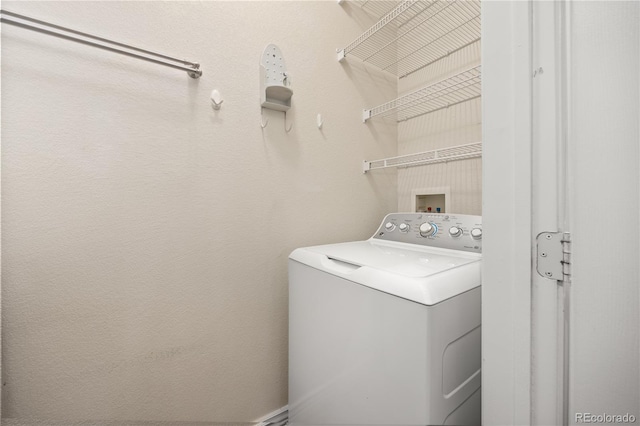 washroom with washer / dryer