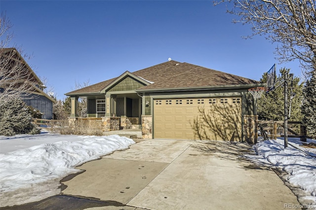 view of front of property with a garage and a porch