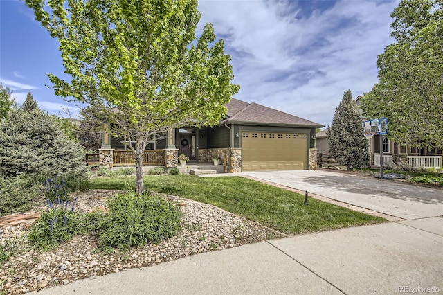 104 Noland Ct, Lyons, CO 80540 - view of front of property featuring stone siding, a porch, a garage, concrete driveway, and a front lawn