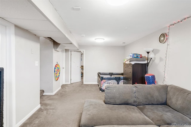 carpeted living room with baseboards