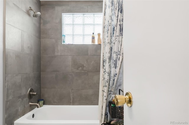 bathroom featuring shower / tub combo with curtain