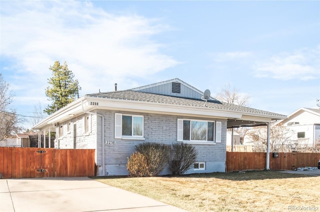 view of front of home with roof with shingles and fence