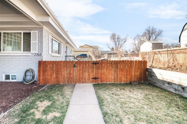 view of yard featuring a gate and fence