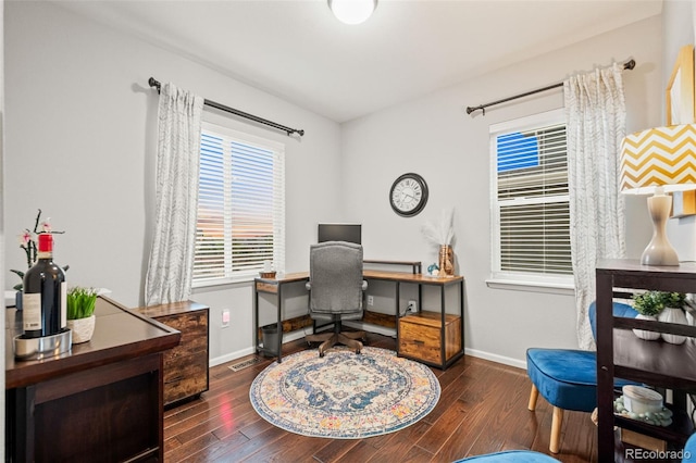 office with baseboards, wood finished floors, and visible vents
