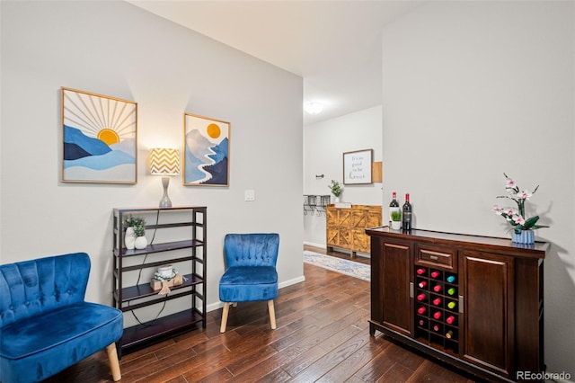 living area with dark wood finished floors and baseboards