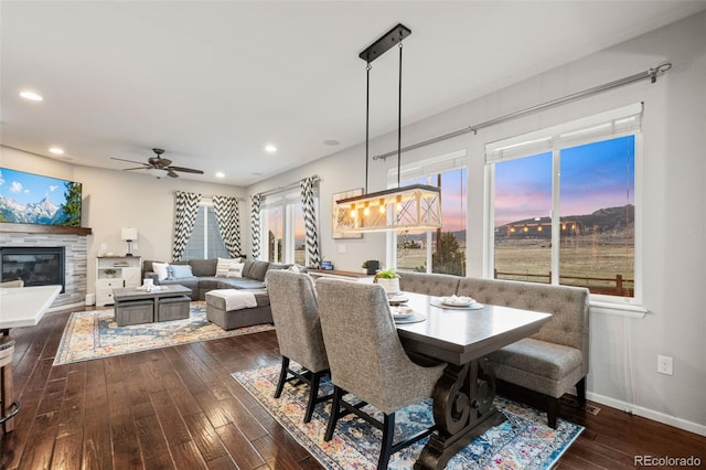 dining room with dark wood finished floors, baseboards, ceiling fan, and recessed lighting