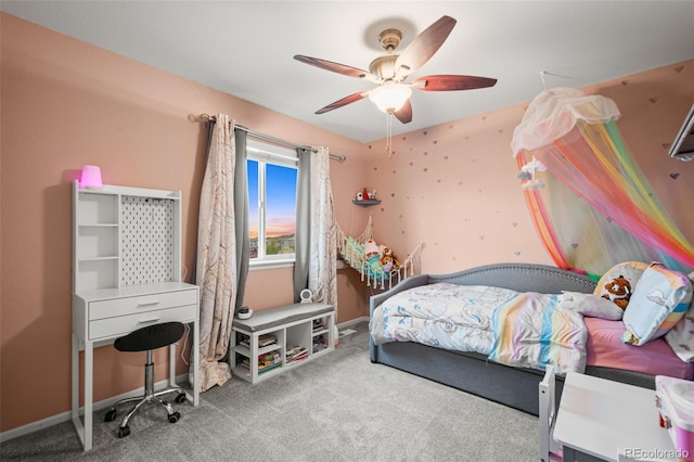 bedroom featuring baseboards, a ceiling fan, and carpet flooring