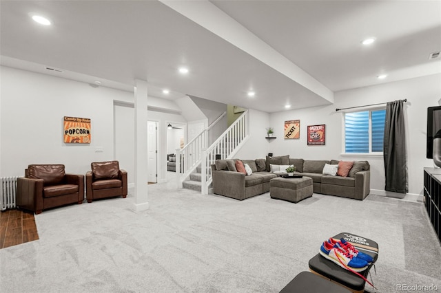 living area with recessed lighting, stairway, baseboards, and carpet