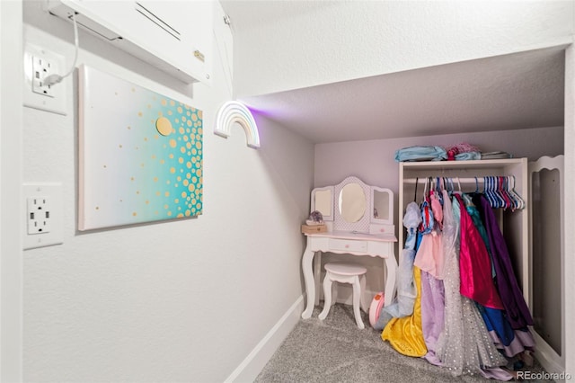 bedroom with baseboards and carpet