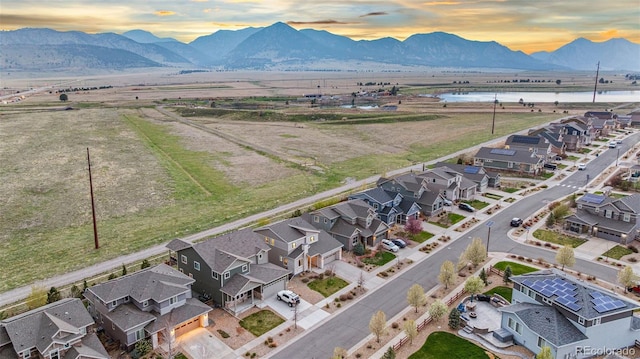 birds eye view of property with a residential view and a water and mountain view