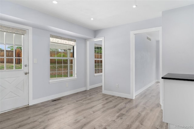 9451 W Hialeah Pl, Littleton, CO 80123 - spare room featuring plenty of natural light, light wood-style flooring, baseboards, and recessed lighting