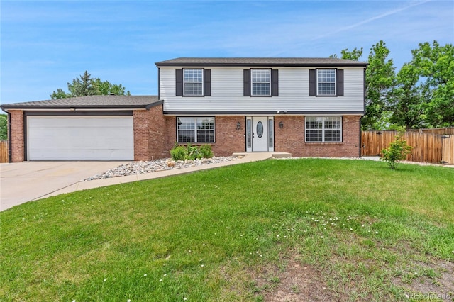 9451 W Hialeah Pl, Littleton, CO 80123 - view of front of home featuring brick siding, driveway, and a garage
