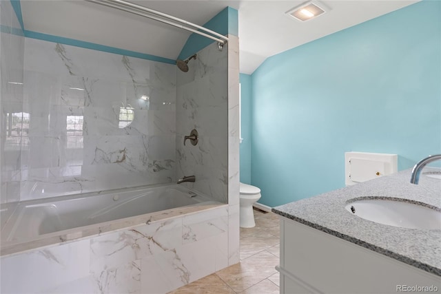 9451 W Hialeah Pl, Littleton, CO 80123 - bathroom with vaulted ceiling, vanity, a combined bath / shower with marble appearance, and toilet