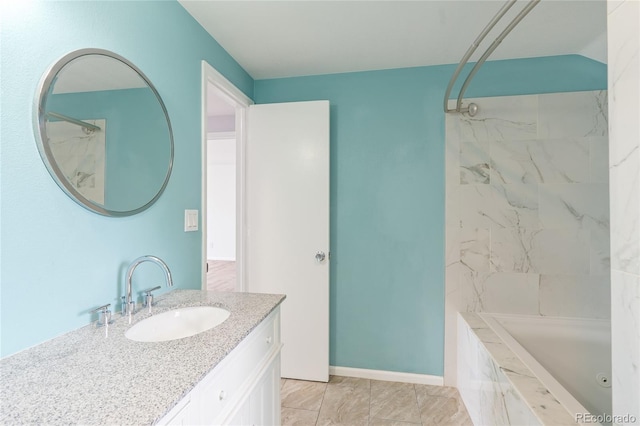 9451 W Hialeah Pl, Littleton, CO 80123 - bathroom featuring vanity and a combined bath / shower with marble appearance
