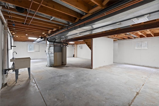 9451 W Hialeah Pl, Littleton, CO 80123 - below grade area featuring heating unit and a sink