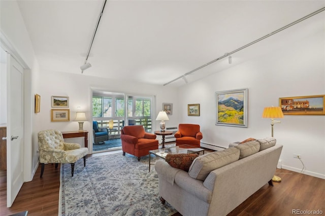 705 S Alton Way Unit 4D, Denver, CO 80247 - living room featuring track lighting, wood finished floors, baseboards, and baseboard heating