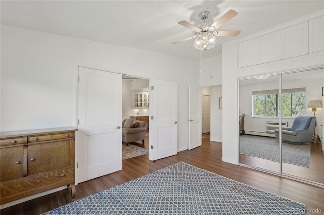 705 S Alton Way Unit 4D, Denver, CO 80247 - bedroom with wood finished floors, a closet, ceiling fan, and baseboard heating