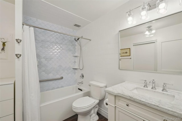705 S Alton Way Unit 4D, Denver, CO 80247 - full bathroom featuring vanity, shower / bath combination with curtain, and toilet