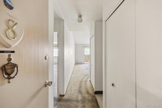 655 S Alton Way Unit 8D, Denver, CO 80247 - corridor featuring light colored carpet