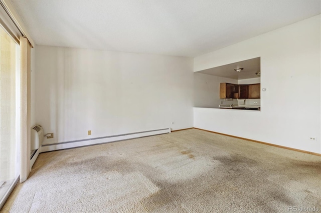 655 S Alton Way Unit 8D, Denver, CO 80247 - empty room with carpet flooring, a baseboard radiator, and baseboards