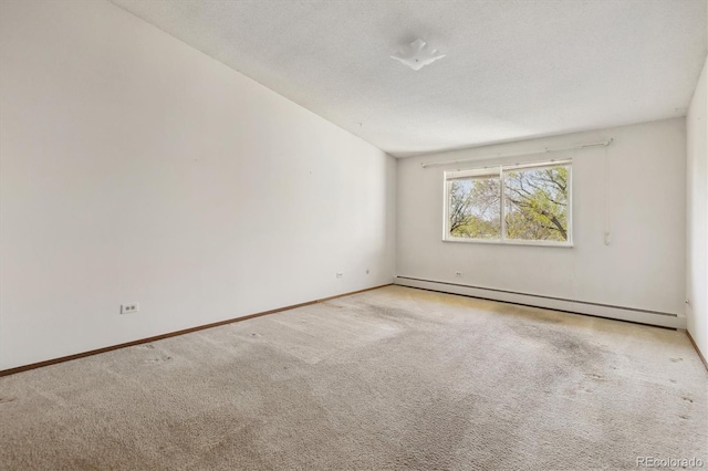 655 S Alton Way Unit 8D, Denver, CO 80247 - carpeted spare room with a baseboard heating unit and baseboards