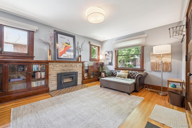 3044 W 40th Ave, Denver, CO 80211 - living area featuring wood finished floors and a brick fireplace