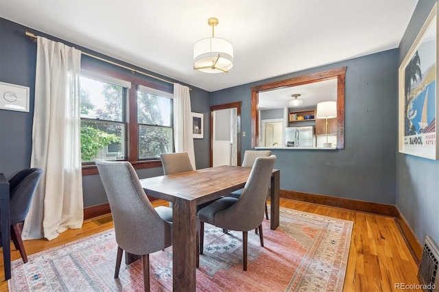 3044 W 40th Ave, Denver, CO 80211 - dining space featuring light wood-type flooring and baseboards