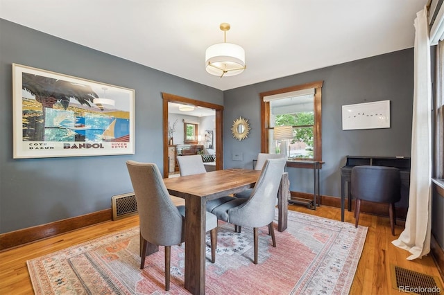3044 W 40th Ave, Denver, CO 80211 - dining area featuring baseboards and wood finished floors