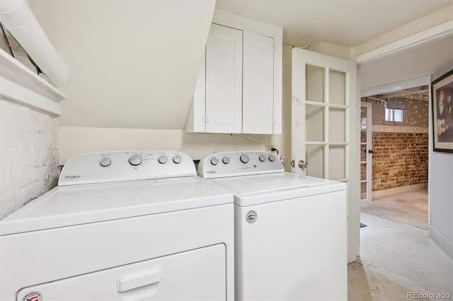 3044 W 40th Ave, Denver, CO 80211 - washroom with washing machine and dryer, brick wall, and cabinet space