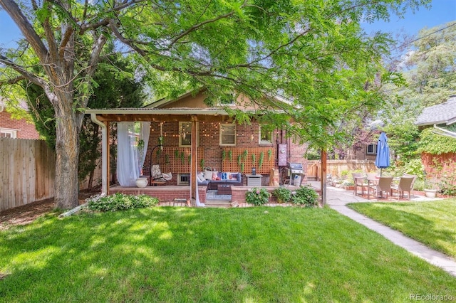 3044 W 40th Ave, Denver, CO 80211 - back of house featuring a patio, outdoor lounge area, and brick siding