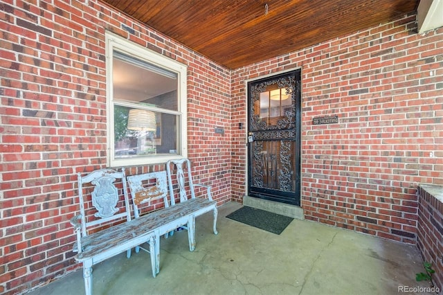 3044 W 40th Ave, Denver, CO 80211 - property entrance featuring covered porch and brick siding