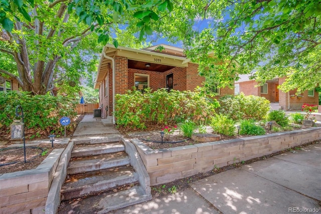 3044 W 40th Ave, Denver, CO 80211 - view of property hidden behind natural elements featuring brick siding