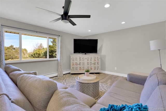 living area featuring baseboards, wood finished floors, a baseboard radiator, ceiling fan, and recessed lighting