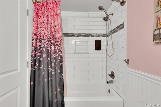 full bath featuring shower / bath combination with curtain and wainscoting