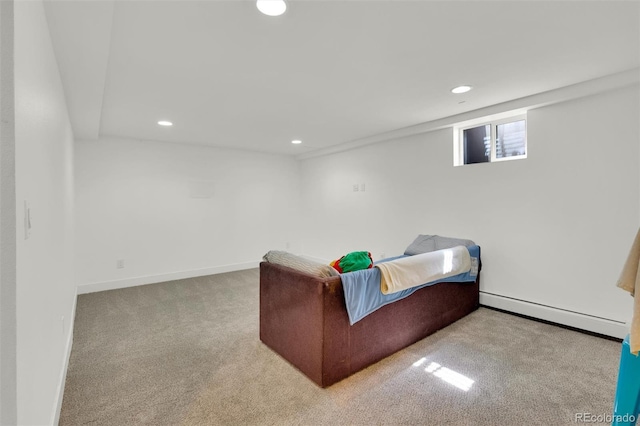 sitting room featuring a baseboard heating unit, recessed lighting, carpet flooring, and baseboards