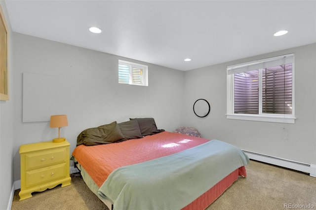 bedroom with light colored carpet, baseboard heating, recessed lighting, and baseboards
