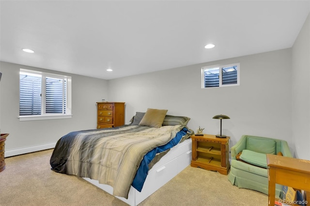 carpeted bedroom with baseboard heating and recessed lighting