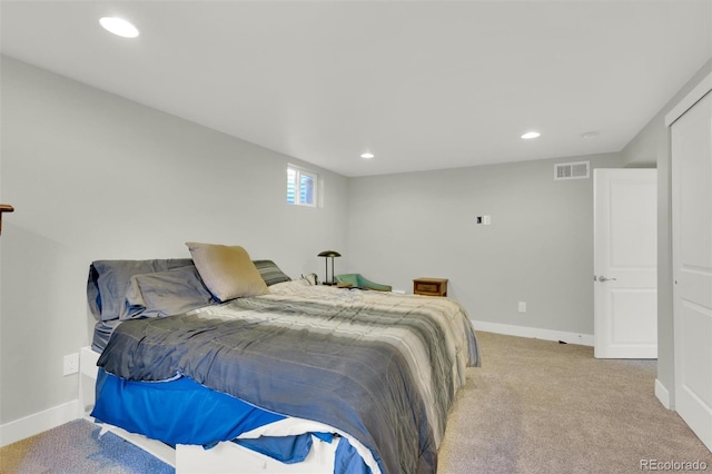 bedroom with baseboards, light carpet, and recessed lighting
