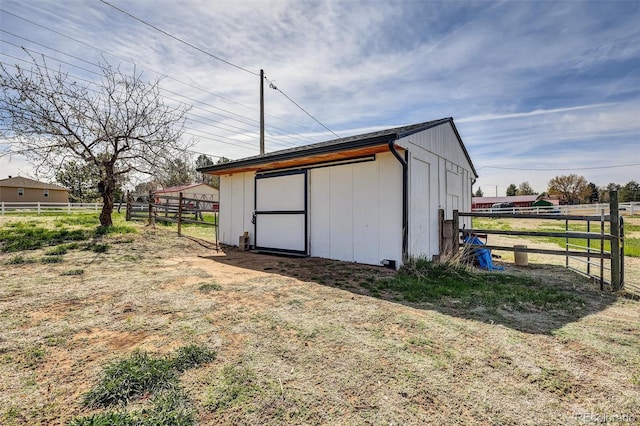 view of outdoor structure with fence and an outdoor structure