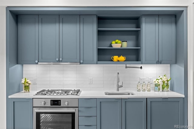 1750 Wewatta St Unit 1227, Denver, CO 80202 - kitchen with appliances with stainless steel finishes, decorative backsplash, light countertops, and open shelves