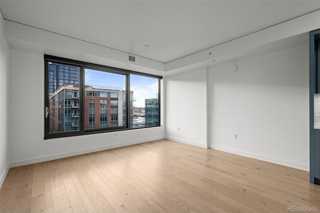 1750 Wewatta St Unit 1227, Denver, CO 80202 - empty room featuring light wood-style floors and baseboards