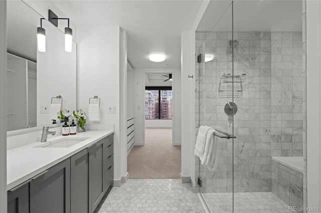 1750 Wewatta St Unit 1227, Denver, CO 80202 - full bathroom featuring vanity, a shower stall, tile patterned floors, and ceiling fan