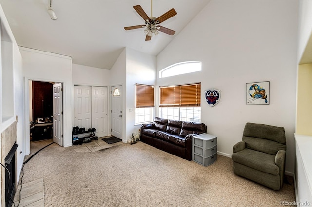 carpeted living room featuring high vaulted ceiling and ceiling fan