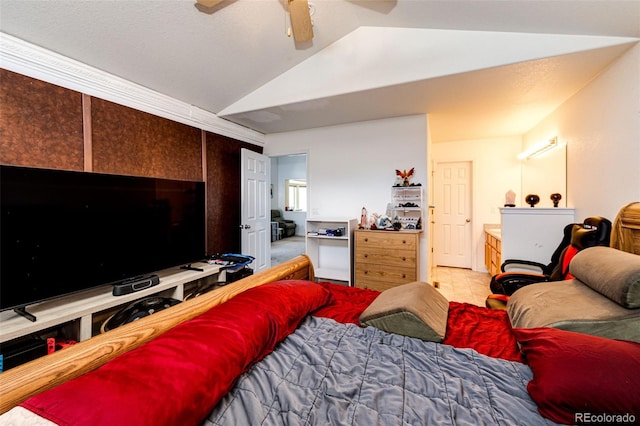 tiled bedroom with ceiling fan and vaulted ceiling