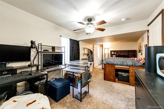 carpeted bedroom with ceiling fan and a textured ceiling