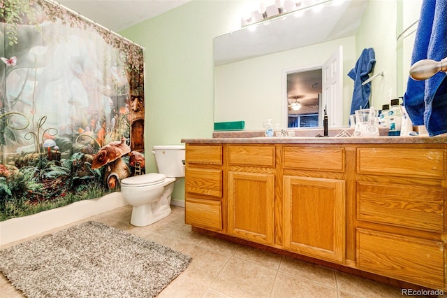 full bathroom featuring tile patterned floors, vanity, toilet, and shower / bathtub combination with curtain