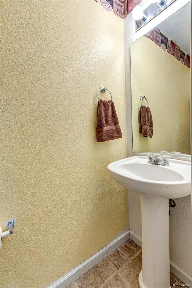 bathroom with tile patterned floors and sink